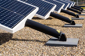 Blue rotating solar panels tilted axis tracker, future innovation energy concept