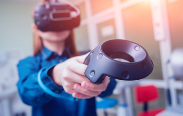 Eye treatment. Patient in virtual reality goggles. Checking the girl's vision with the help of virtual reality.