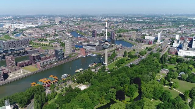 Aerial footage of Rotterdam city showing Het Park the Koetshuys Euromast Parkhaven with Chinese Supermarket and New Ocean Paradise also showing Delfshaven and Erasmus MC in background 4k quality
