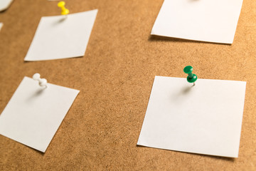 white stickers for notes on a cardboard background
