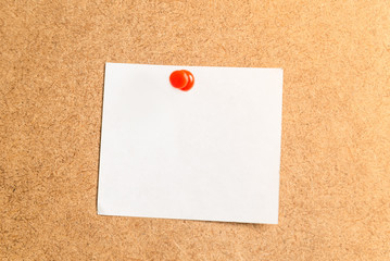 white sticker for notes on a cardboard background