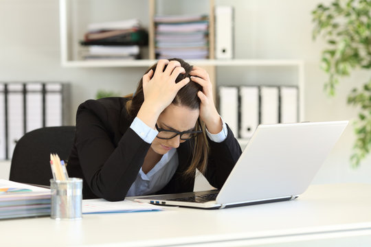Sad office worker complaining after bankruptcy