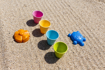 Fototapeta na wymiar Sand and water toys on the beach.