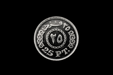 A macro image of a ten piastre coin from Egypt isolated on a black background