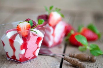 raspberry strawberry dessert, fruit ice cream in a glass with fresh berries