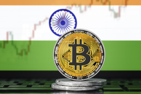 BITCOIN (BTC) cryptocurrency; coin bitcoin on the background of the flag of India