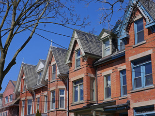 Fototapeta na wymiar renovated Victorian row houses with gables