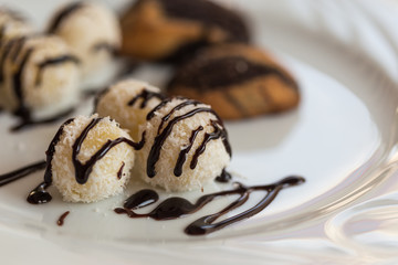 Coconut balls with chocolate sauce
