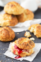 Healthy breakfast. Homemade cheese buns with poppy seeds and berry jam
