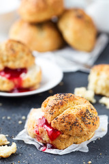 Healthy breakfast. Homemade cheese buns with poppy seeds and berry jam