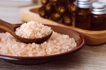 Close up brown organic Himalayan rock salt spa and cinnamon essential oil aroma set on  table , healthy spa relaxation concept