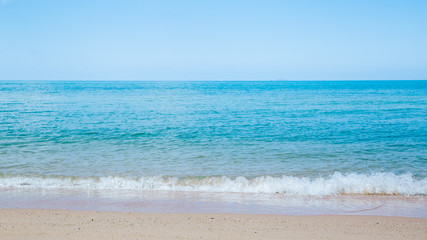 Fototapeta na wymiar Sand and soft wave at the beach background.
