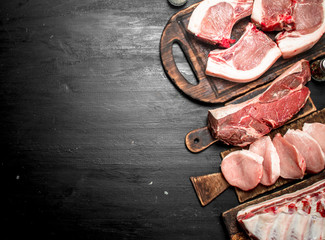 Different types of raw pork meat and beef.