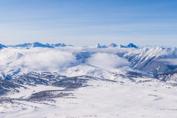 Fototapeta na wymiar An aerial view of the Rocky Mountains in Alberta, Canada in winter
