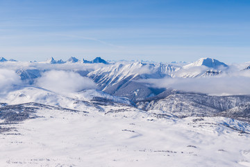 An aerial view of the Rocky Mountains in Alberta, Canada in winter