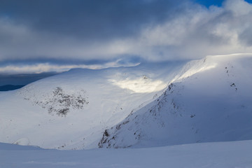 Beautiful  winter scenery in the mountains, with fresh snow, and mist, on a bright sunny day