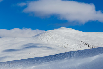 Bright winter scenery in the Alps with fresh snow