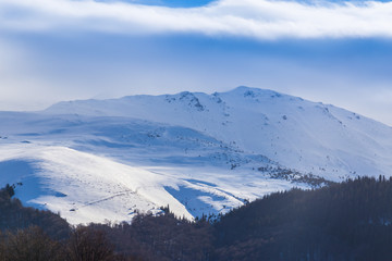 Naklejka na ściany i meble Bright winter scenery in the Alps with fresh snow