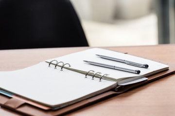 two pen on empty notebook,Selective focus