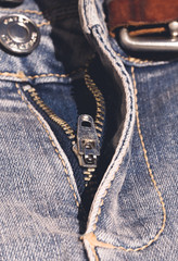 Metal zipper on blue jeans