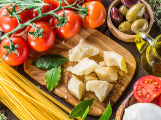 Variety of popular italian food on the wooden table. Top view.