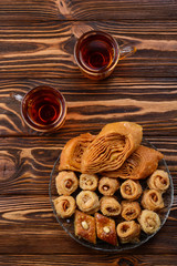 Turkish sweet baklava on plate with Turkish tea.