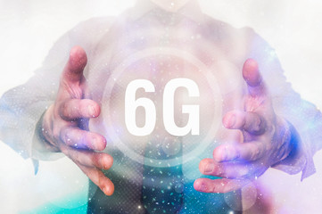 Man is showing 6G interface symbol between his hands