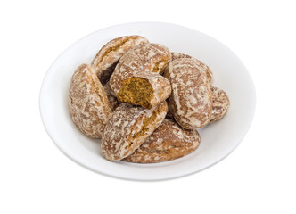 Gingerbreads on the white dish on a white background