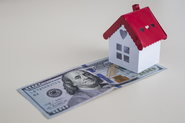 real estate and mortgage investment.Being an easy way for homeowner.House and dollar on the white background.