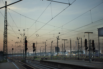 Fototapeta na wymiar Empty railroad tracks of Mannheim Hauptbahnhof railway station in morning