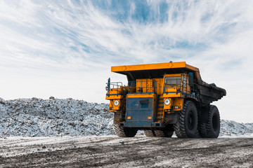 Large quarry dump truck. Loading the rock in dumper. Loading coal into body truck. Production...