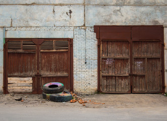 old doors to the bilding and old tires