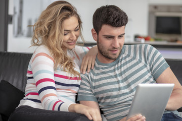 Young family couple together at home casual