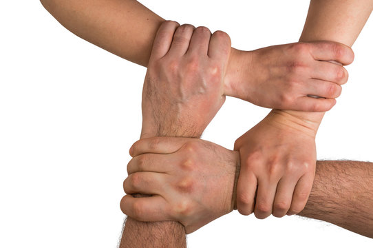 Four Human Arms Crossed And Holding Together