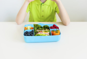 Bright lunch box with healthy food