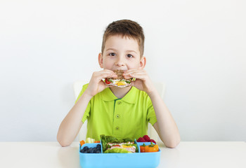 8 year old young boy eating healthy food