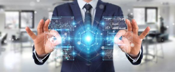 Businessman using digital screens interface with holograms datas 3D rendering