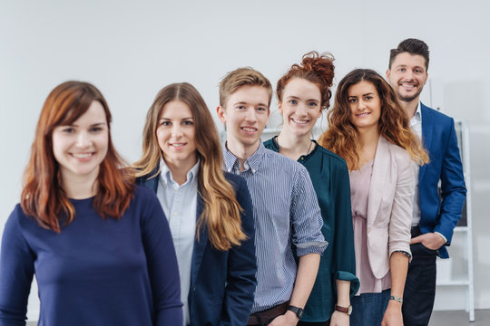 Group portrait of smiling people at office