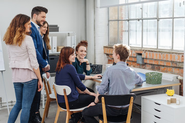 Smiling team talking in office