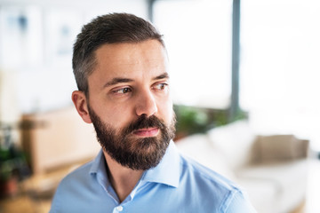 Portrait of a handsome man at home.