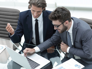 two business man working on laptop