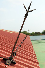 lightning rod or lightning conductor (Copper pole) on the roof of building for protection high...