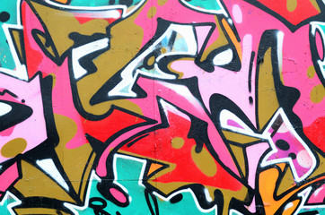 Fragment of a beautiful graffiti pattern in pink and green with a black outline. Street art...