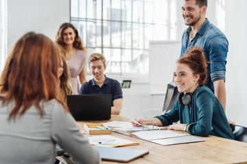 Group of young business people in a team meeting