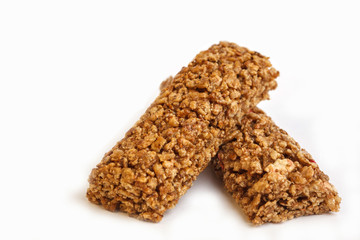 Granola bars isolated on white background. Healthy sweet dessert snack. Cereal granola bar with nuts and berries on white