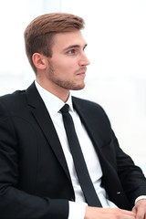 closeup .portrait of a businessman sitting on a chair