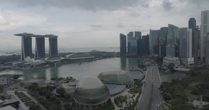 Aerial drone view of Singapore city skyline during cloudy day at Marina Bay, Singapore