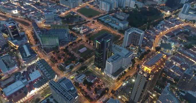 4k aerial footage of Singapore skyscrapers with city skyline during cloudy evening