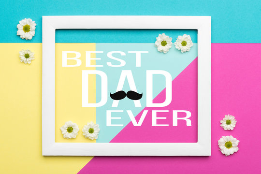 Happy Father's day Pastel Candy Colours Background. Floral flat lay minimalism geometric patterns Father day greeting card with picture frame.