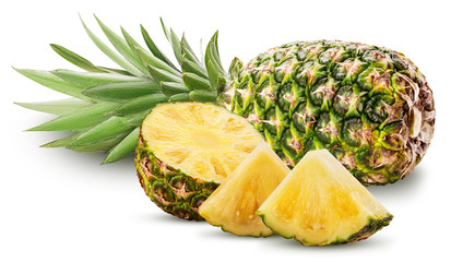 Pineapple fruit whole and cut in half and slice with green leaves